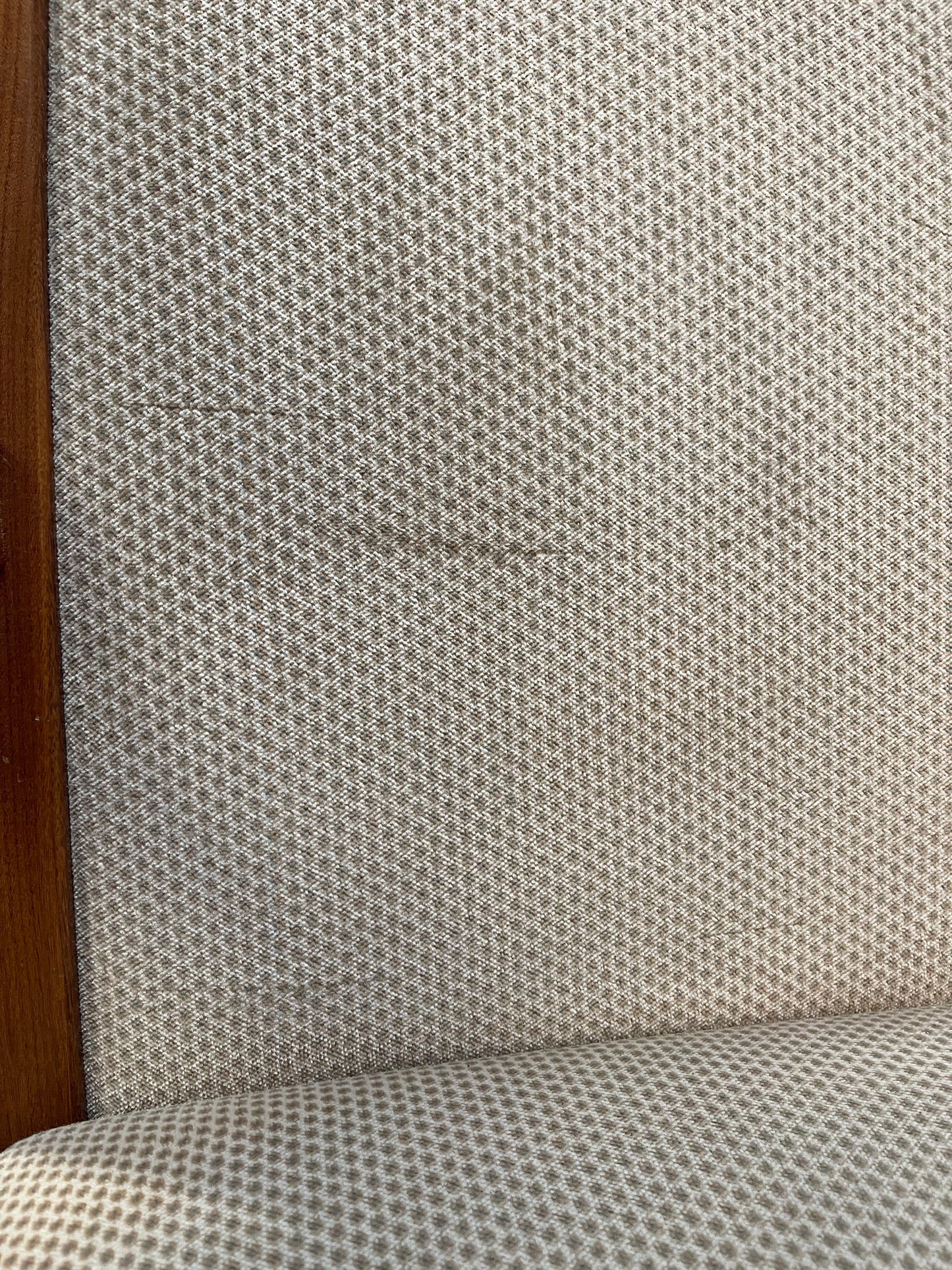 Pair of dining chairs with armrests and light fabric upholstery
