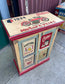 Quirky hand painted cabinet with retro / vintage style adverts