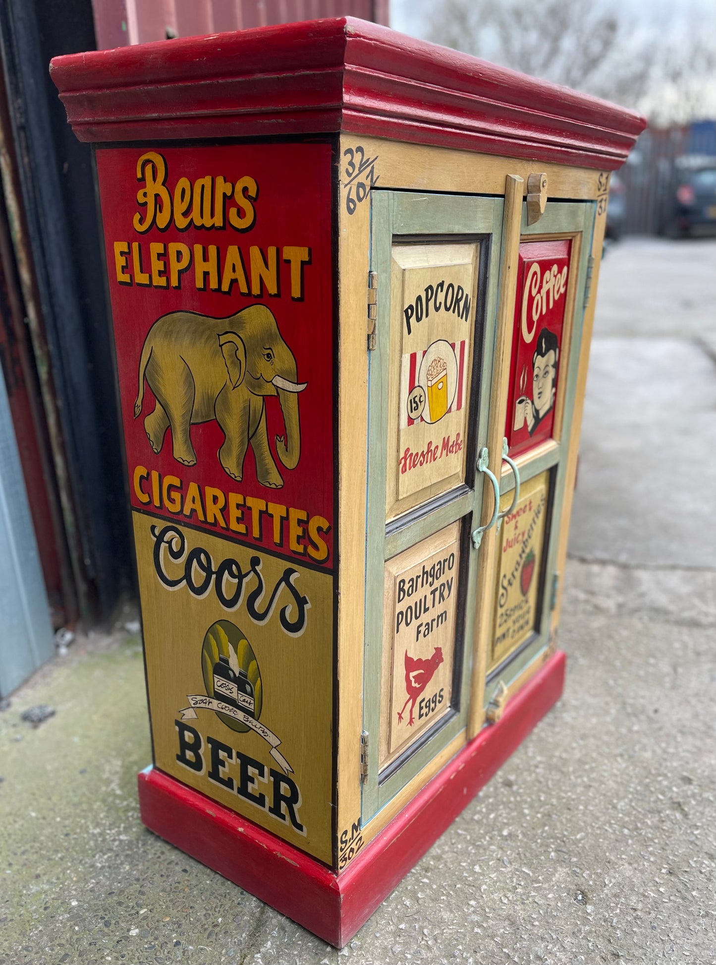 Quirky hand painted cabinet with retro / vintage style adverts