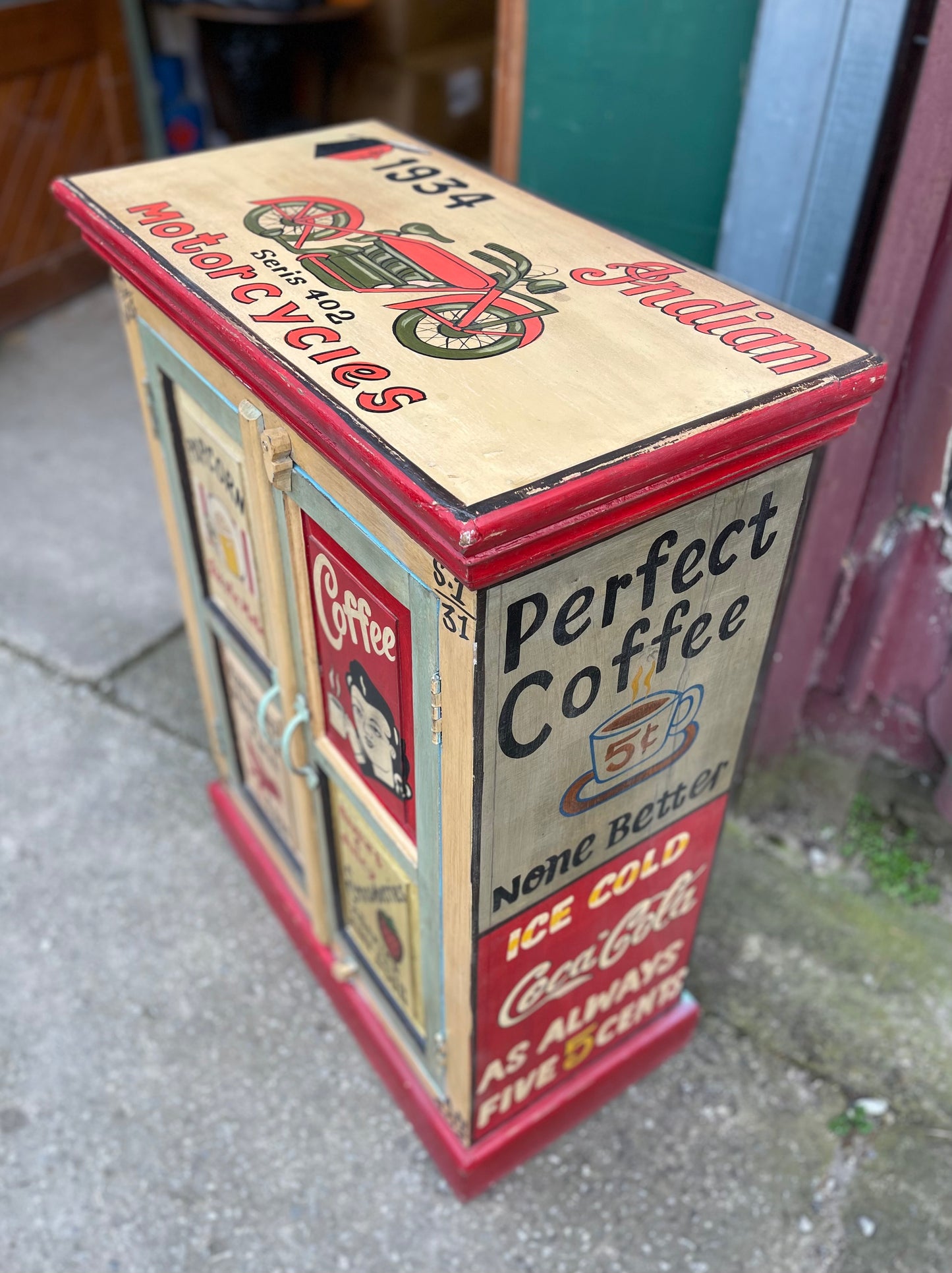 Quirky hand painted cabinet with retro / vintage style adverts