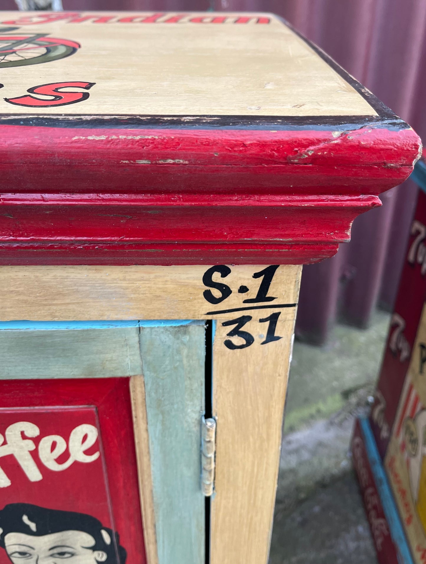 Quirky hand painted cabinet with retro / vintage style adverts