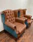 Pair of tan leather wingbacks with bright blue back and sides