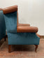 Pair of tan leather wingbacks with bright blue back and sides