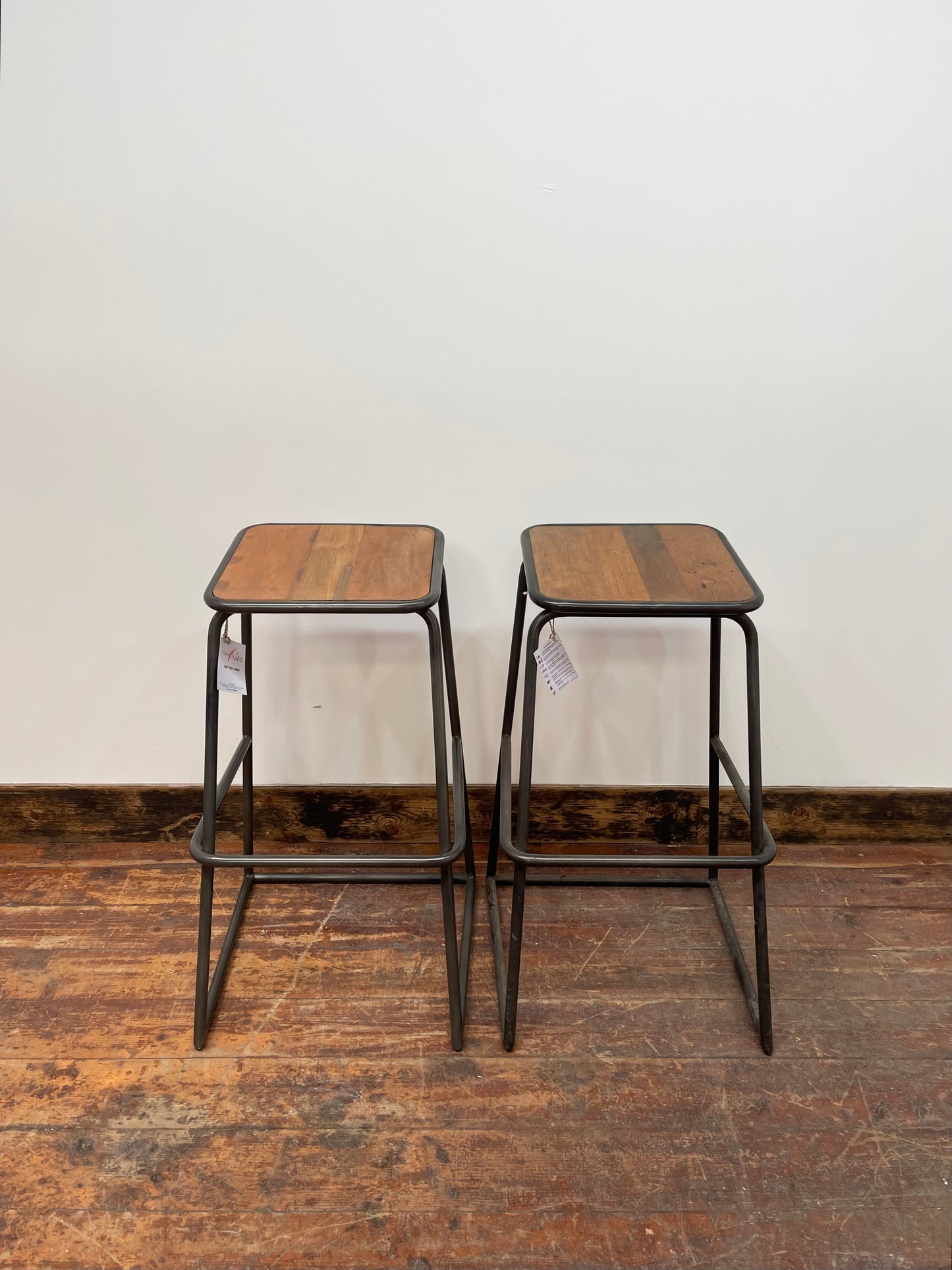Industrial style bar stools with tilted seats