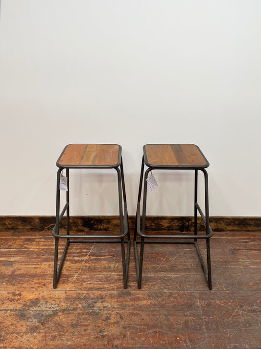 Industrial style bar stools with tilted seats