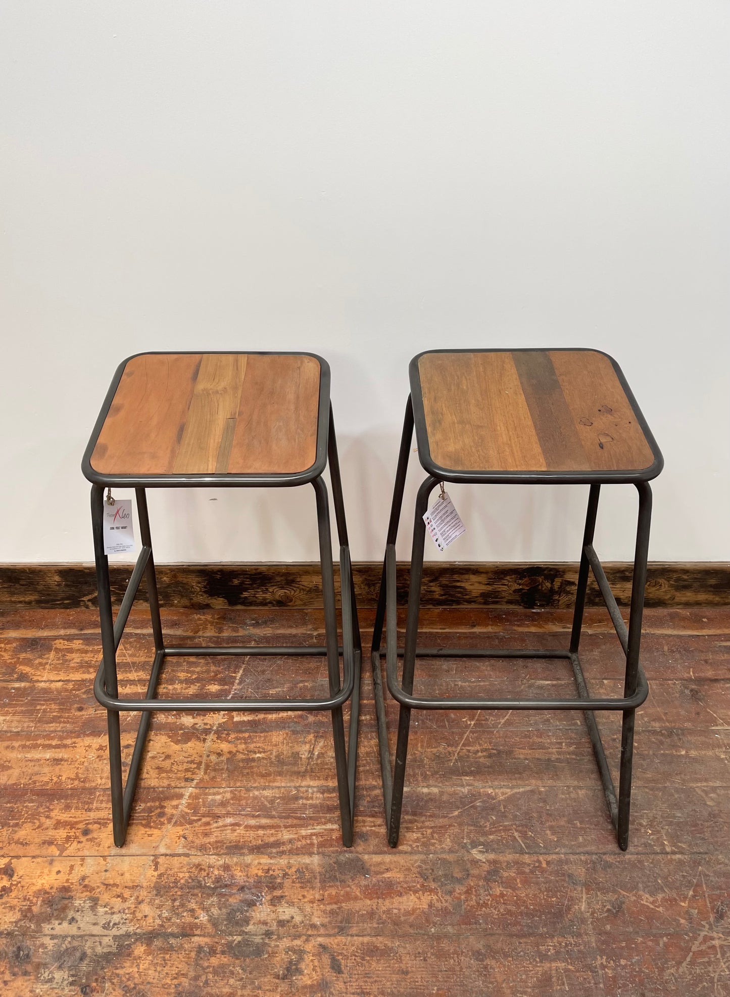 Industrial style bar stools with tilted seats