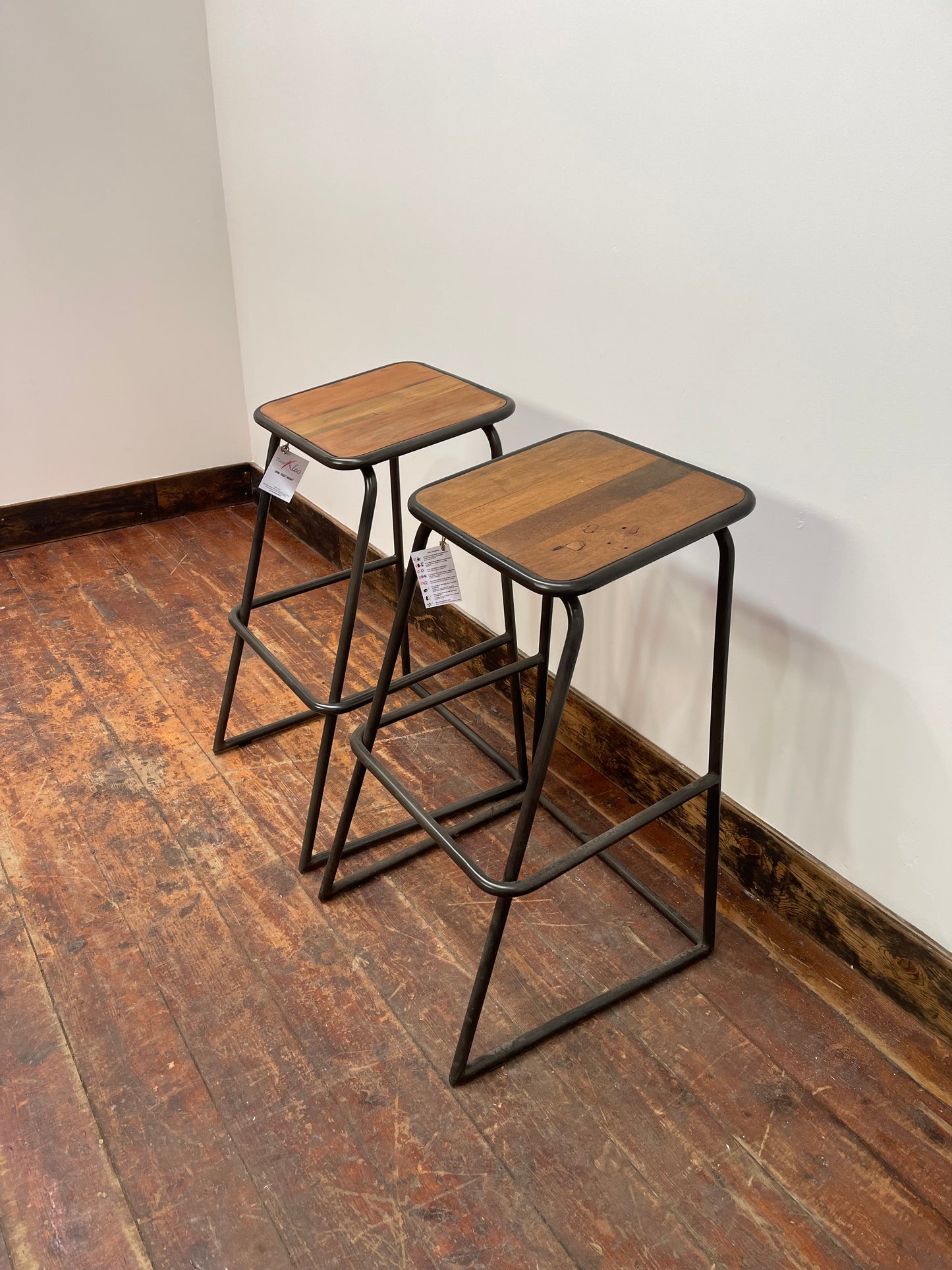 Industrial style bar stools with tilted seats