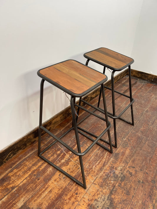 Industrial style bar stools with tilted seats