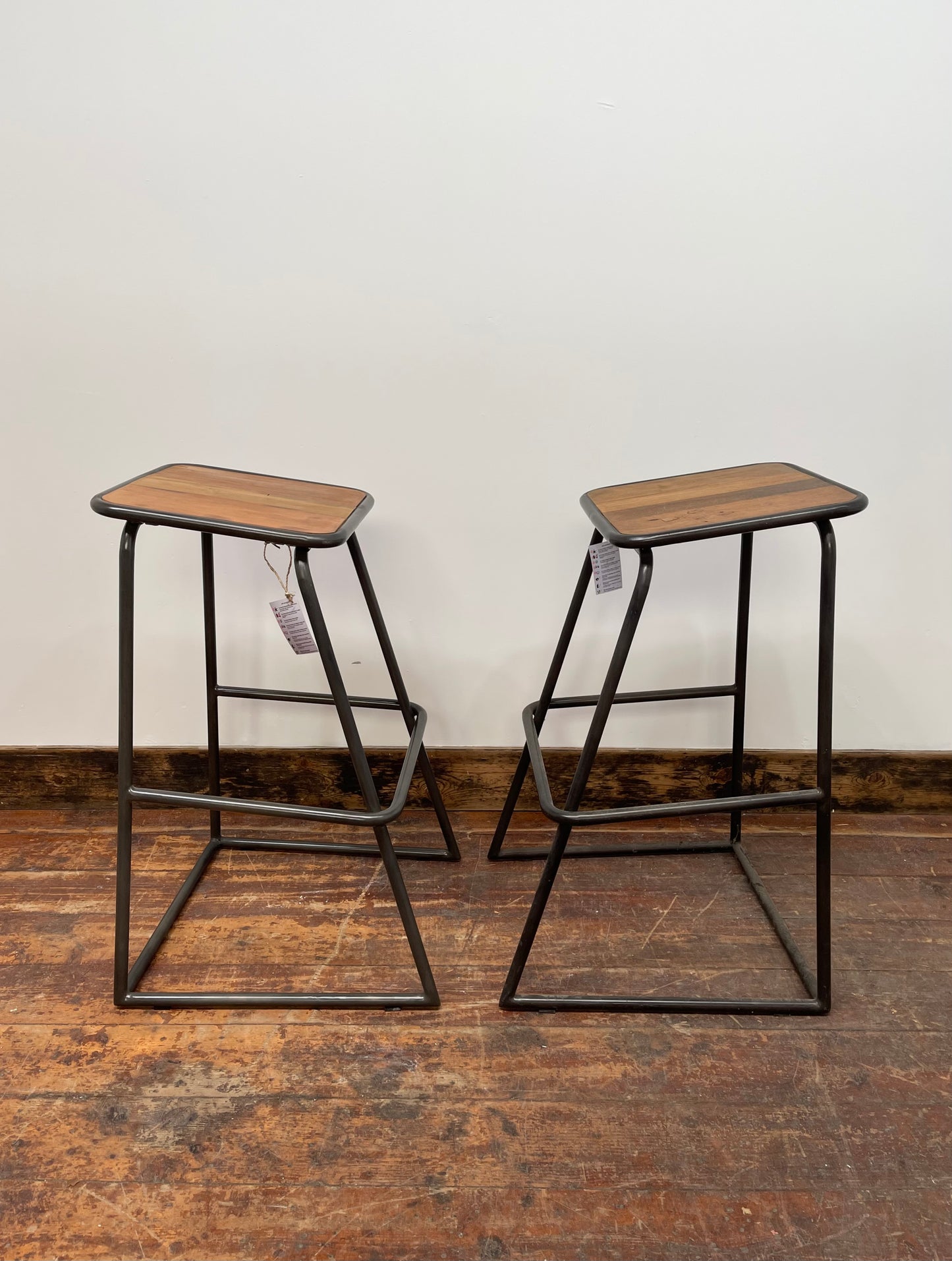 Industrial style bar stools with tilted seats