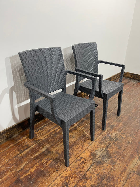 Pair of stackable outdoor pub / bar / cafe chairs in grey with armrests