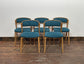 Set of 5 matching dining chairs in light wood with teal / light blue fabric