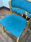 Set of 5 matching dining chairs in light wood with teal / light blue fabric