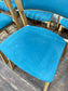 Set of 5 matching dining chairs in light wood with teal / light blue fabric