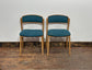 Set of 5 matching dining chairs in light wood with teal / light blue fabric