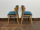 Set of 5 matching dining chairs in light wood with teal / light blue fabric