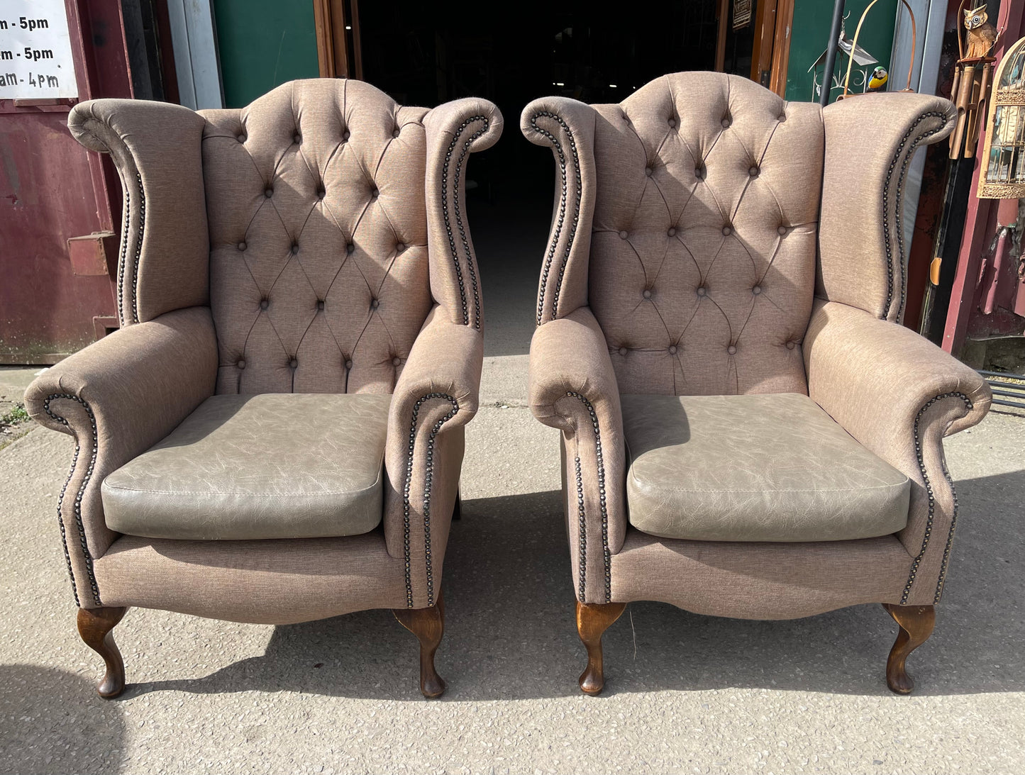 Pair of matching wingback armchairs in light brown / beige fabric
