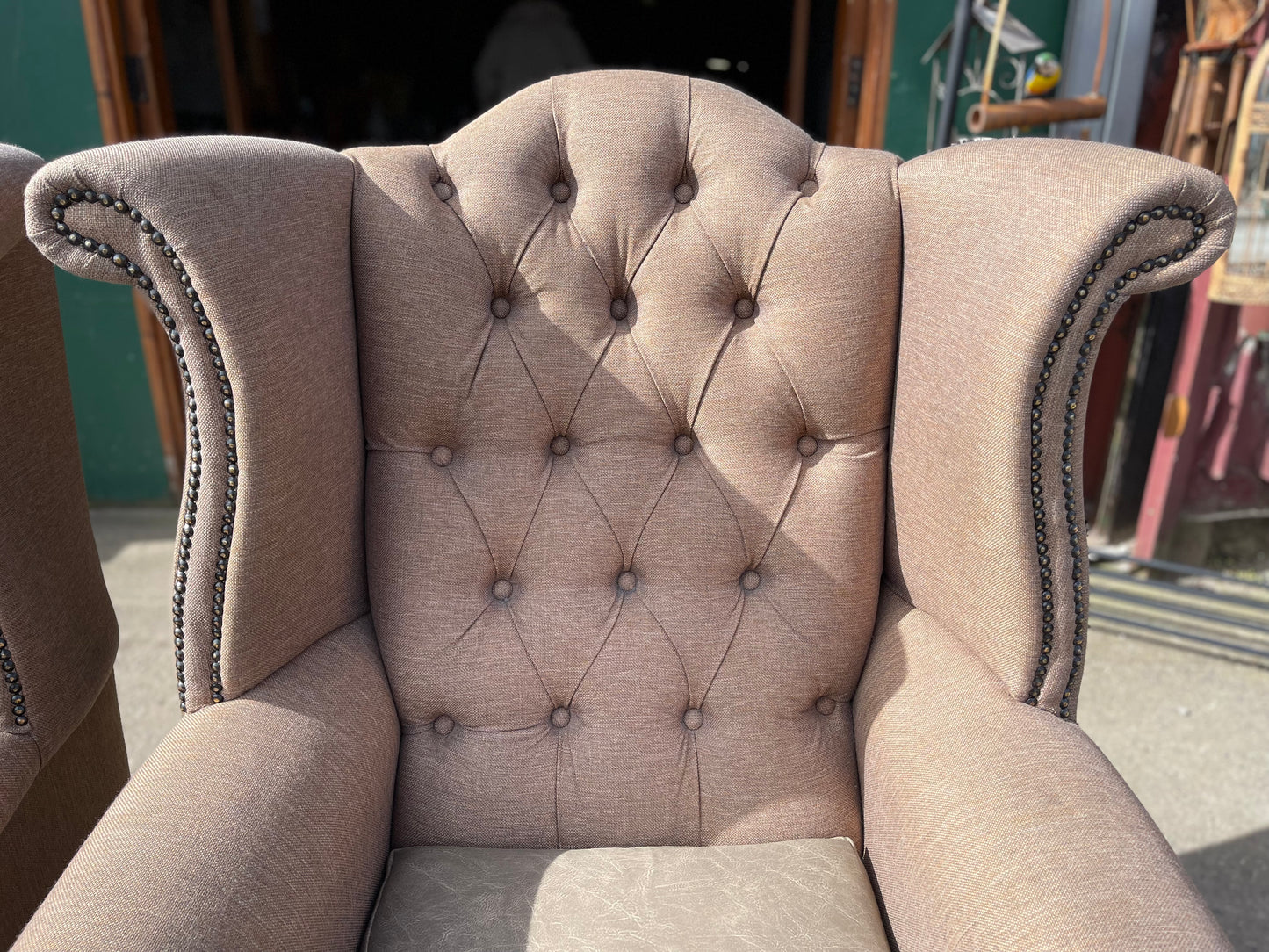Pair of matching wingback armchairs in light brown / beige fabric
