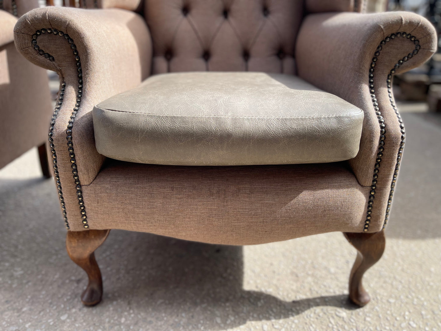 Pair of matching wingback armchairs in light brown / beige fabric