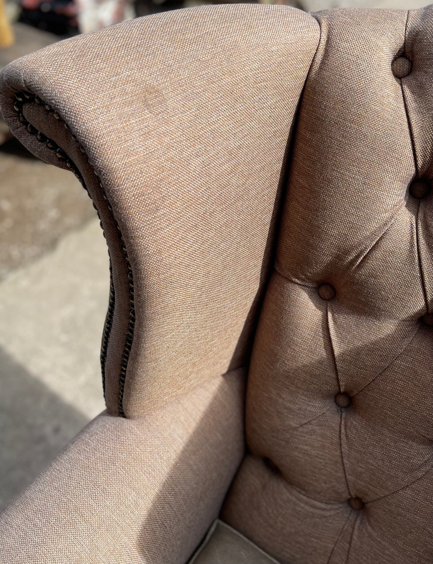 Pair of matching wingback armchairs in light brown / beige fabric