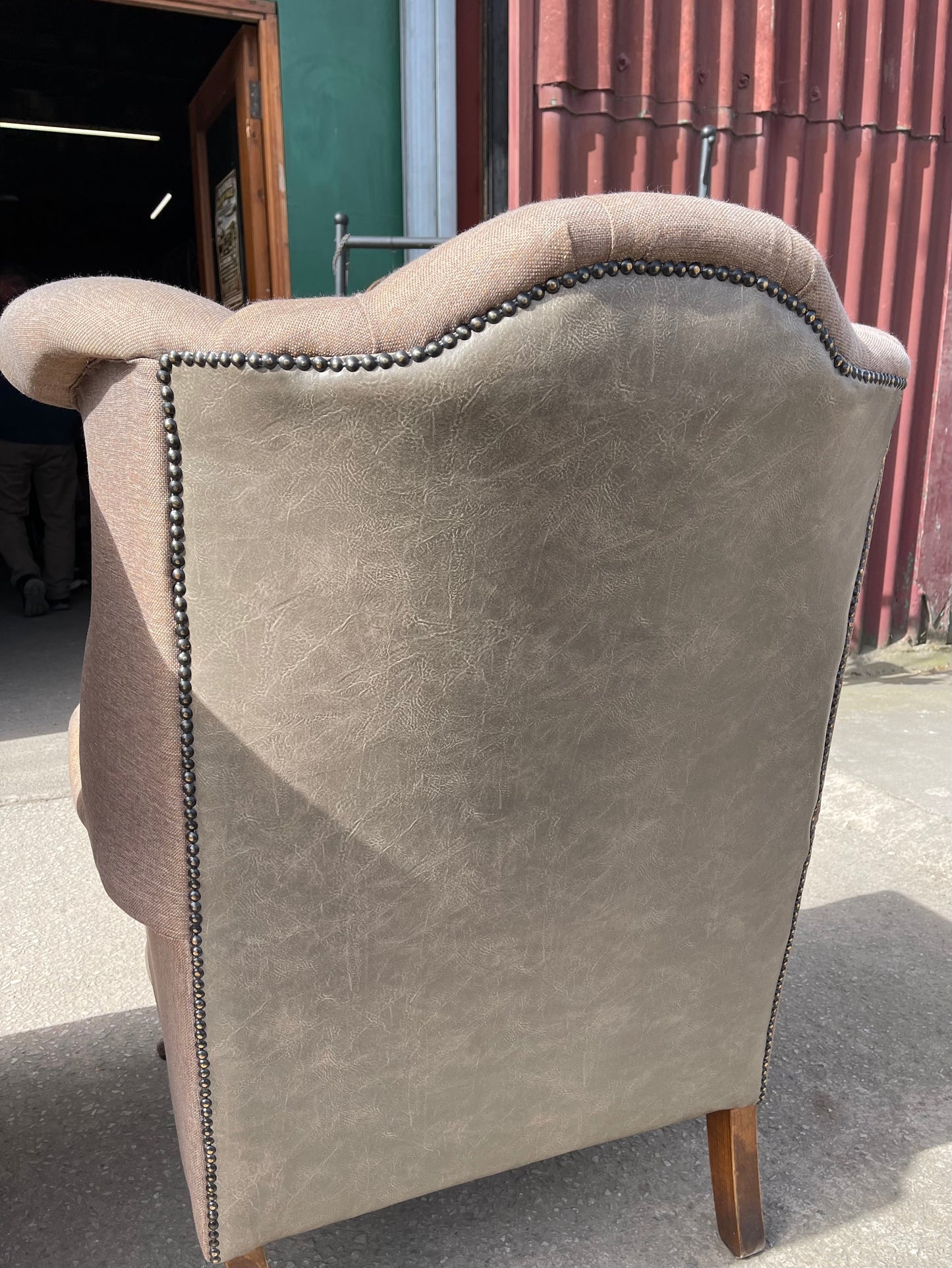 Pair of matching wingback armchairs in light brown / beige fabric