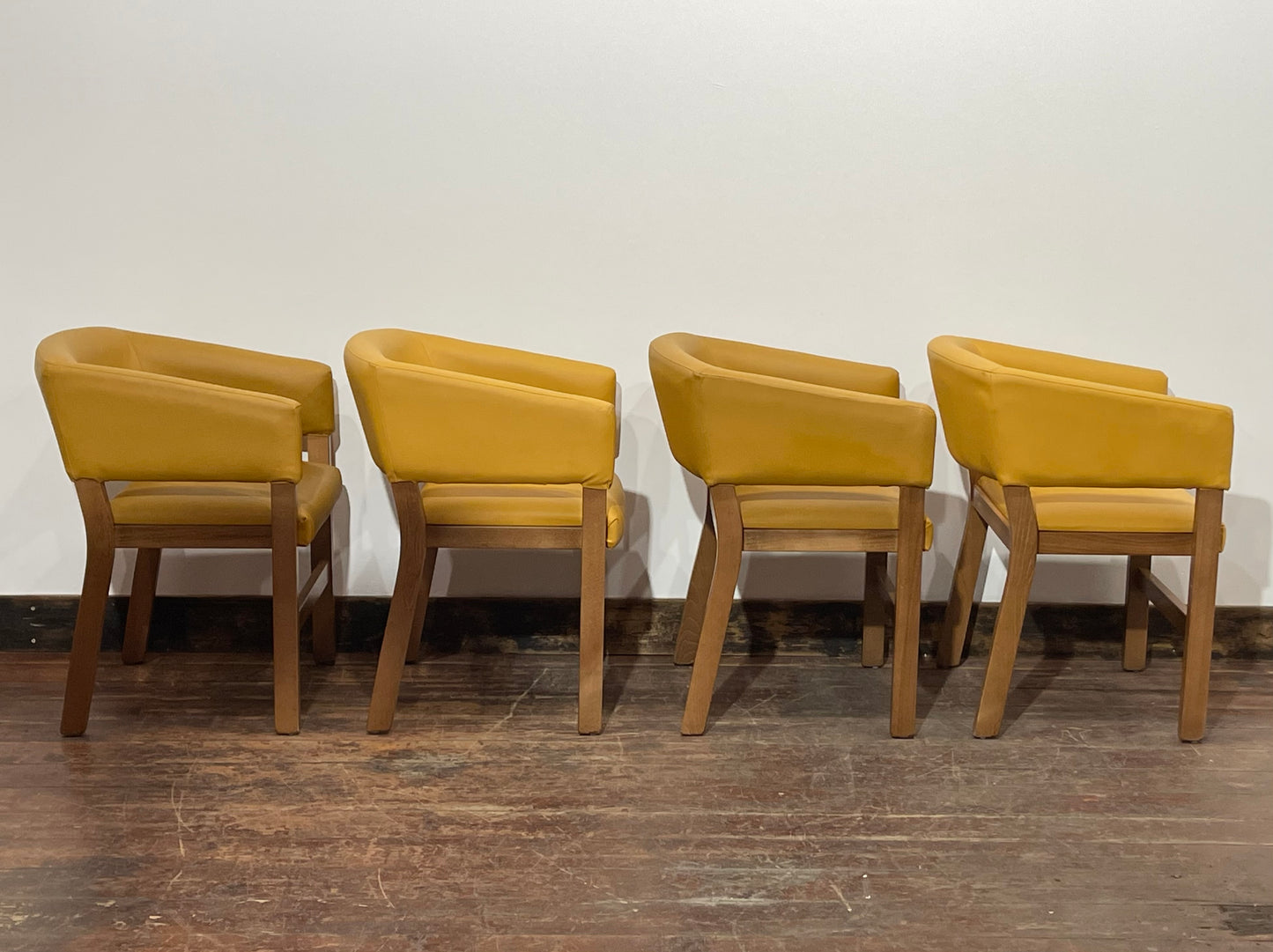 Matching set of 4 yellow tub chairs in faux-leather
