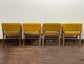 Matching set of 4 yellow tub chairs in faux-leather