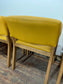 Matching set of 4 yellow tub chairs in faux-leather