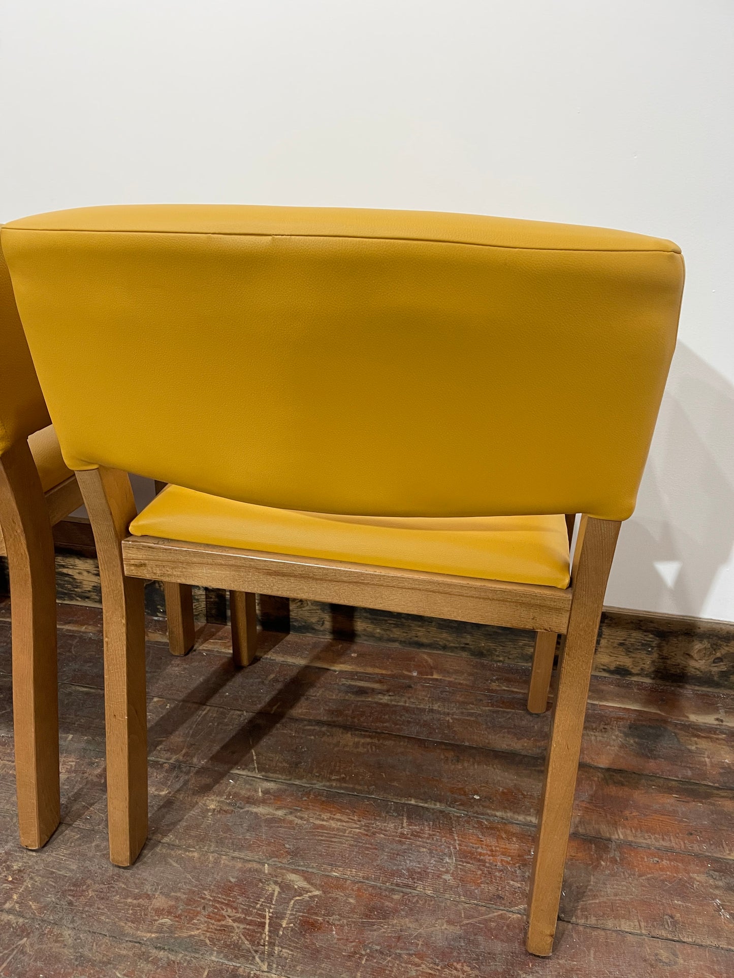 Matching set of 4 yellow tub chairs in faux-leather