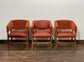 Matching set of 3 red - orange tub chairs in faux-leather