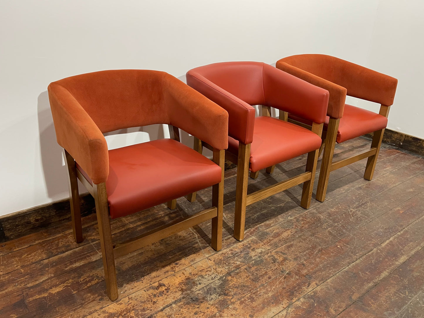 Matching set of 3 red - orange tub chairs in faux-leather