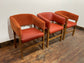 Matching set of 3 red - orange tub chairs in faux-leather