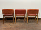 Matching set of 3 red - orange tub chairs in faux-leather