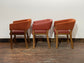 Matching set of 3 red - orange tub chairs in faux-leather
