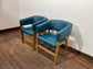 Matching set of 2 tub chairs in blue faux-leather
