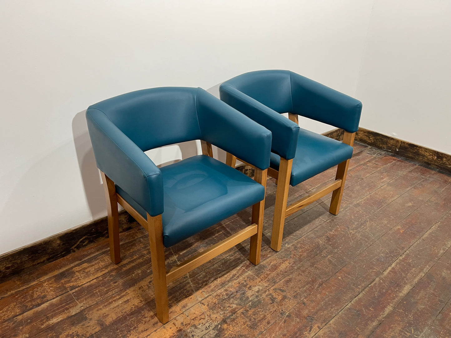 Matching set of 2 tub chairs in blue faux-leather