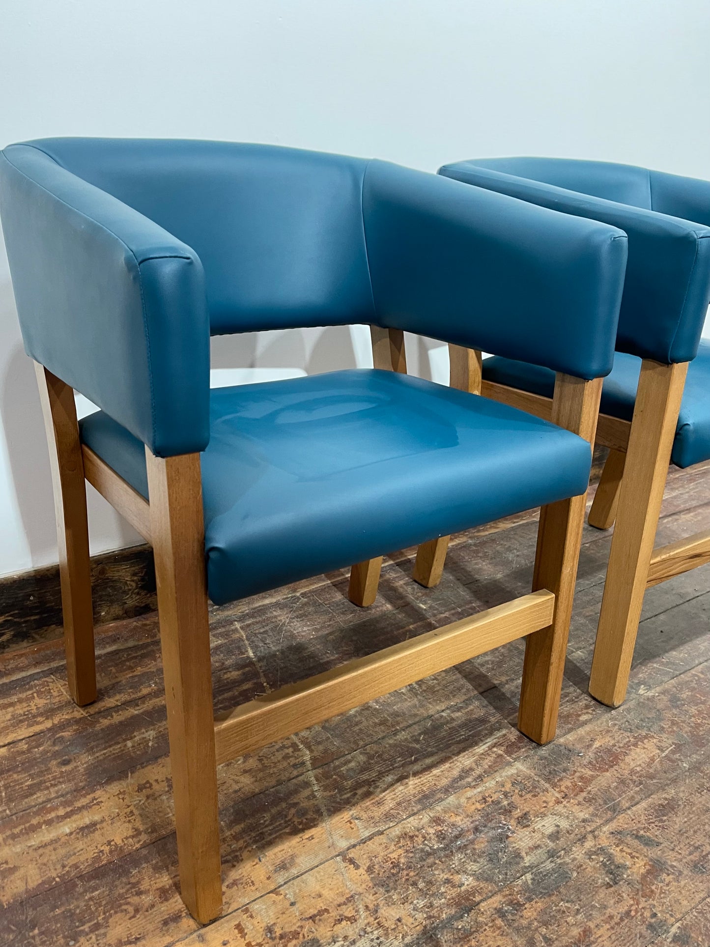 Matching set of 2 tub chairs in blue faux-leather