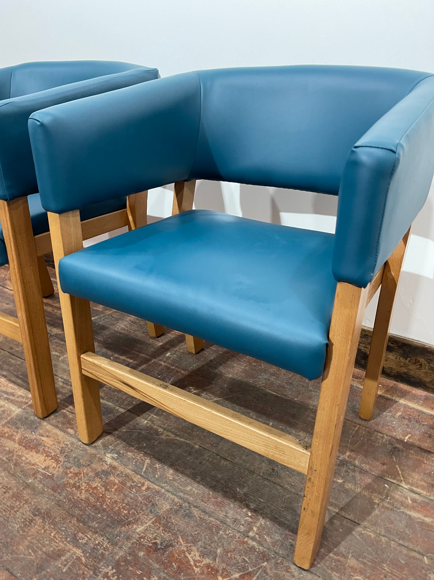 Matching set of 2 tub chairs in blue faux-leather