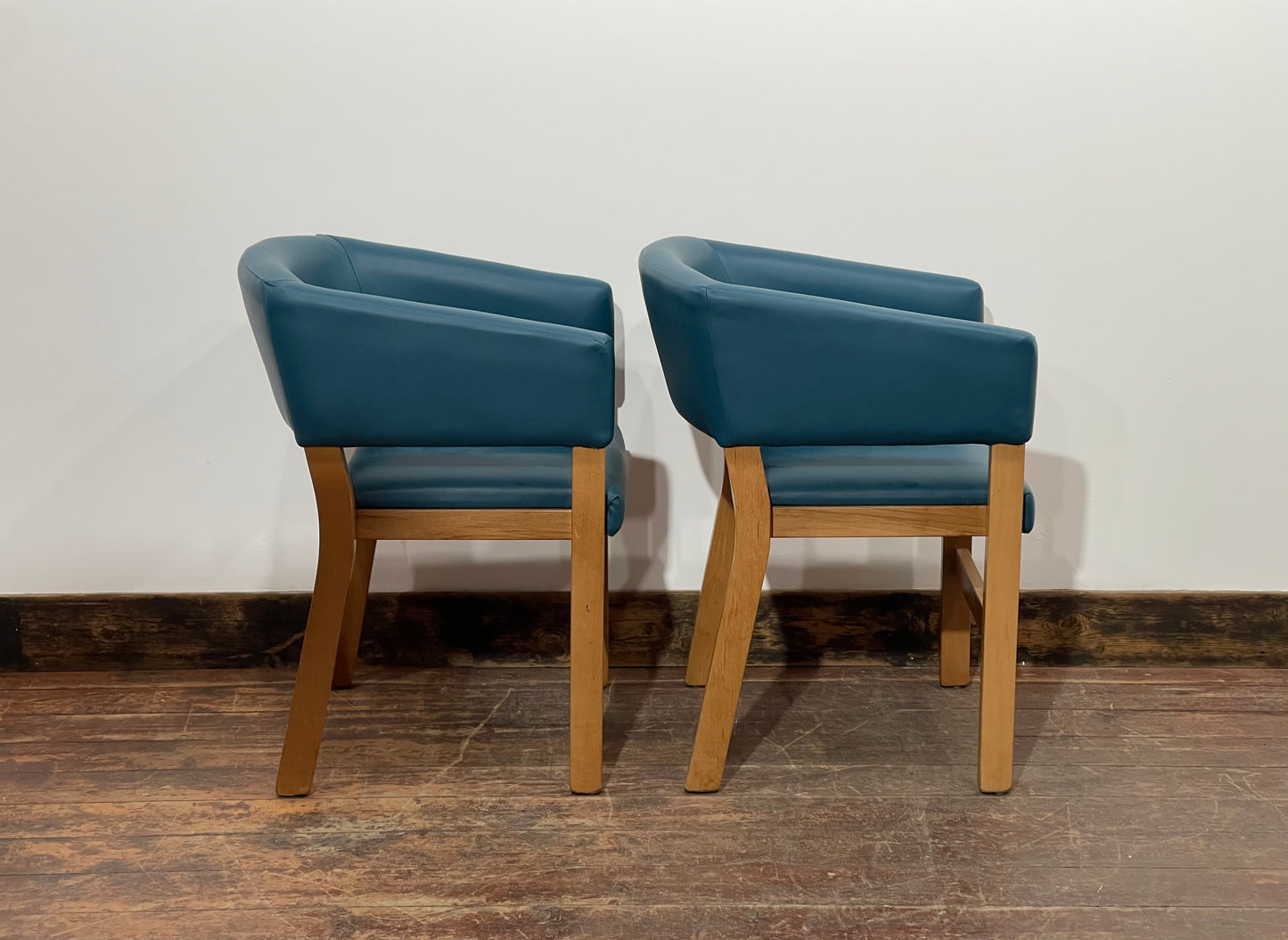 Matching set of 2 tub chairs in blue faux-leather