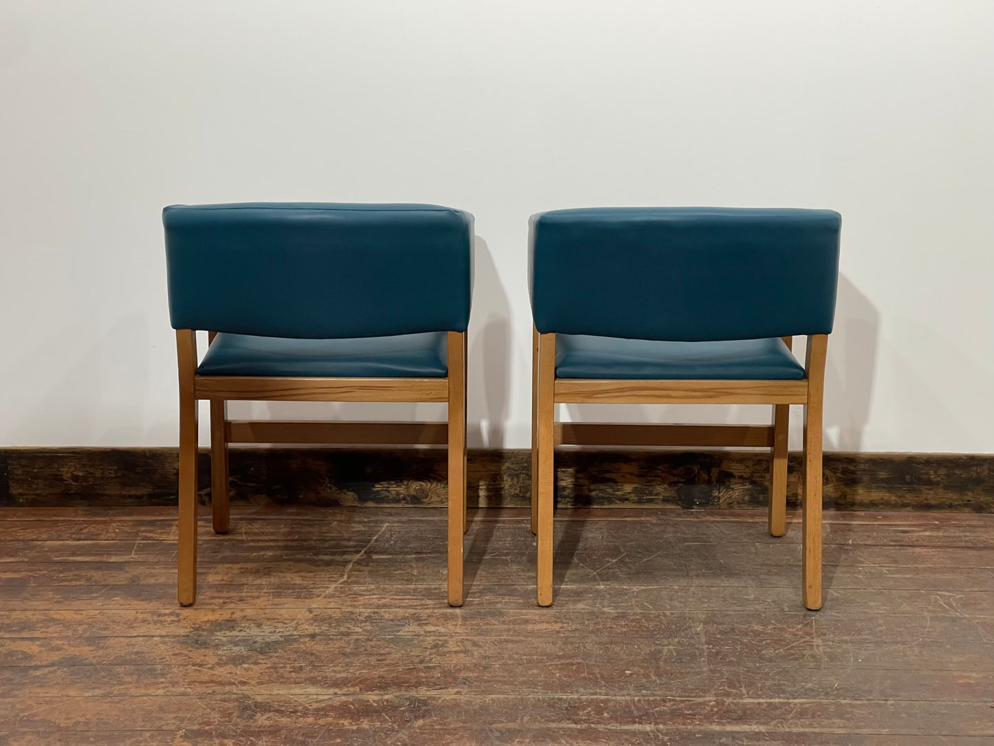 Matching set of 2 tub chairs in blue faux-leather