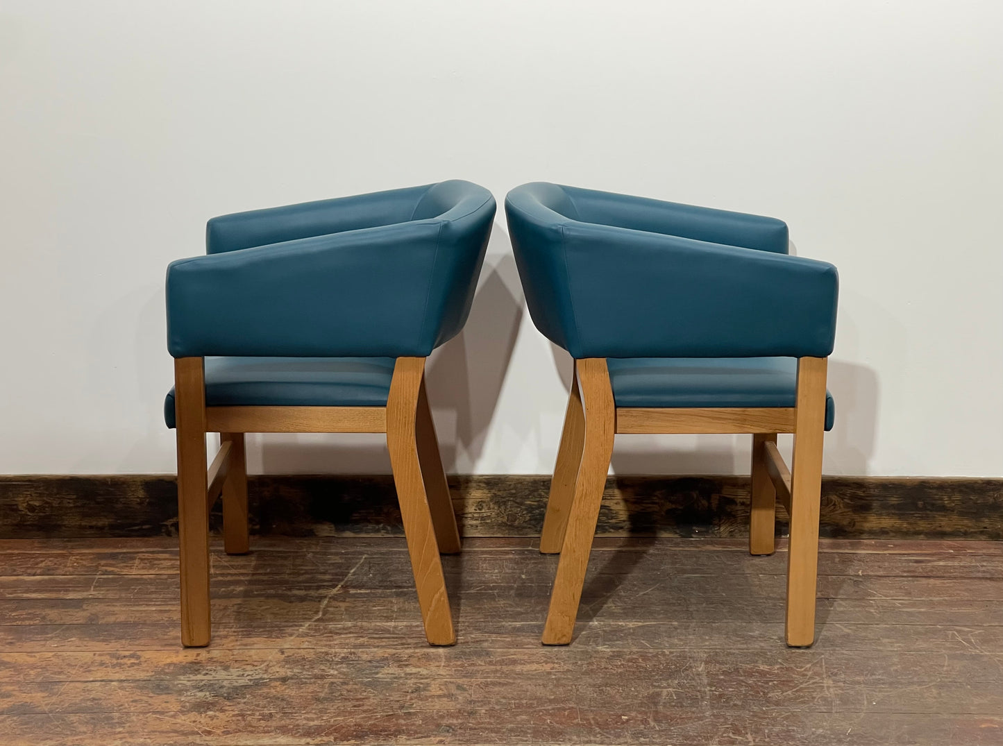 Matching set of 2 tub chairs in blue faux-leather