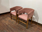 Matching set of 2 pale pink tub chairs in faux-leather