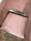 Matching set of 2 pale pink tub chairs in faux-leather