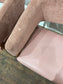 Matching set of 2 pale pink tub chairs in faux-leather