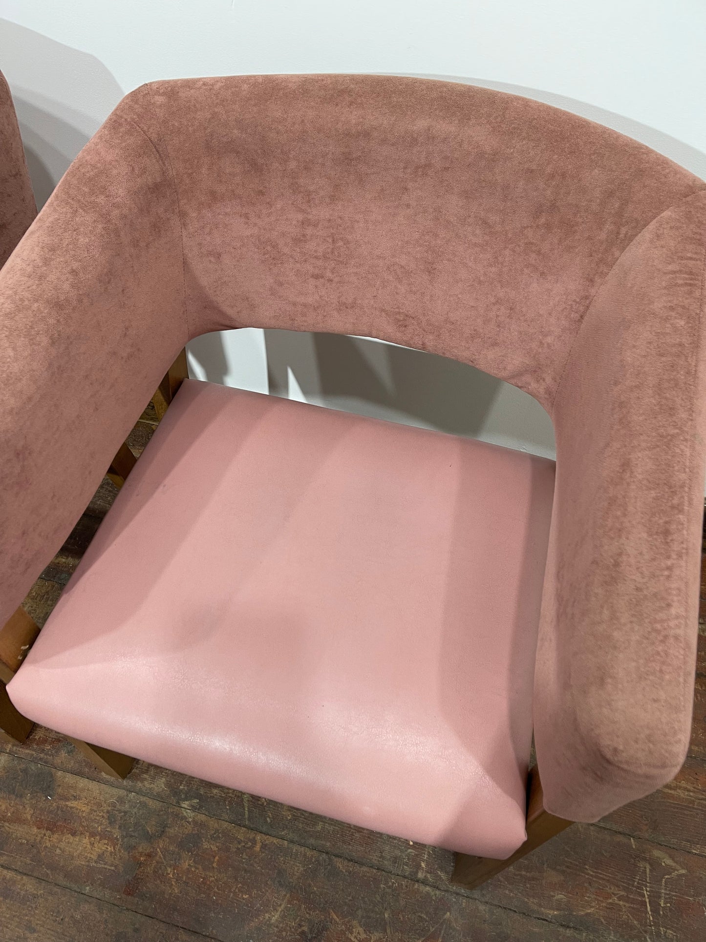 Matching set of 2 pale pink tub chairs in faux-leather