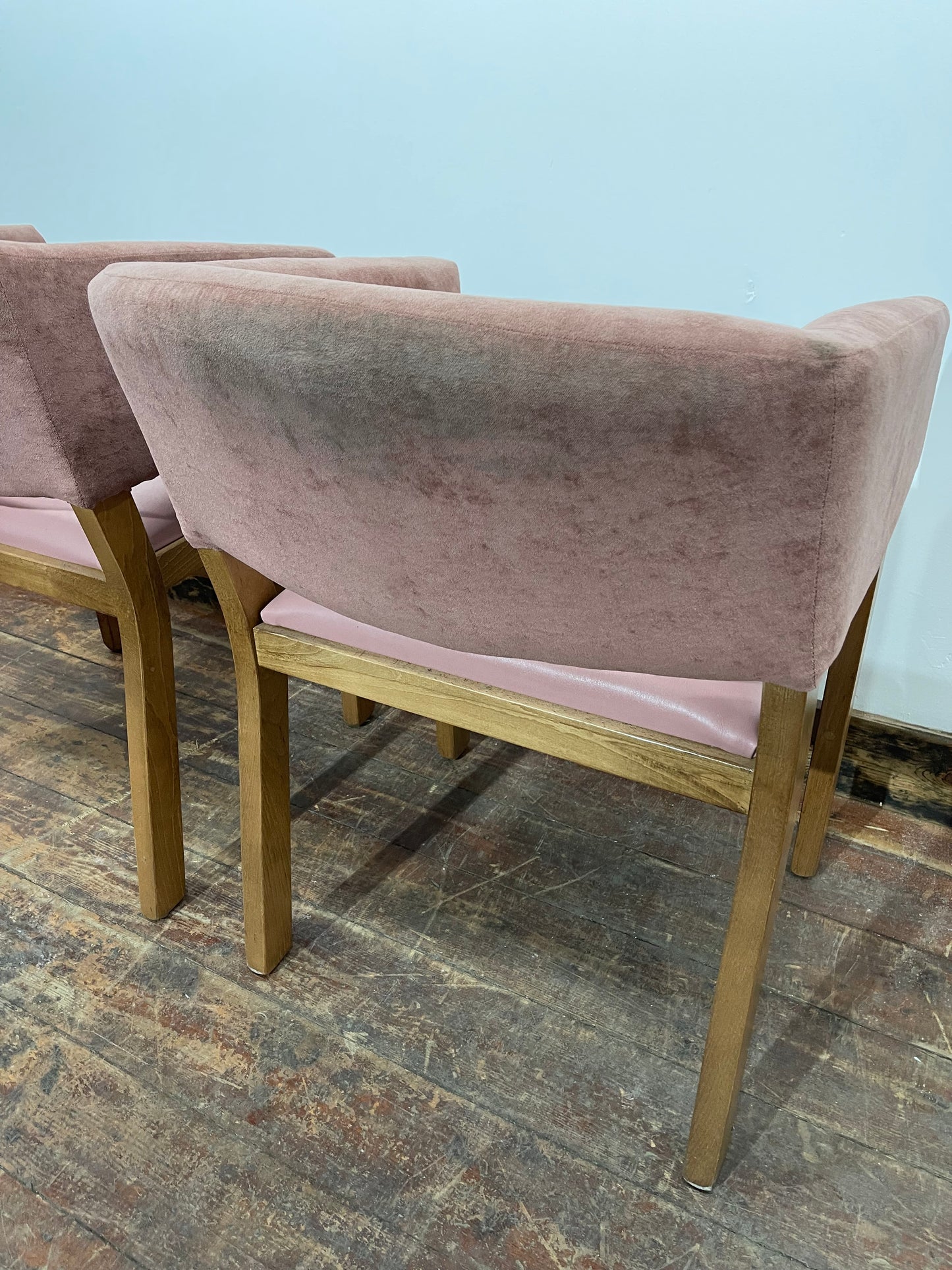 Matching set of 2 pale pink tub chairs in faux-leather
