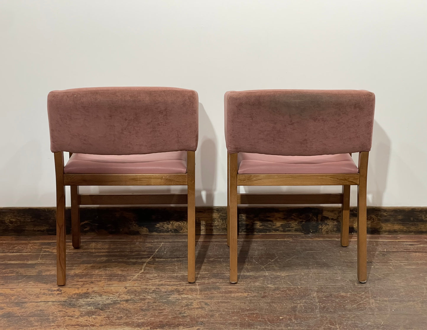 Matching set of 2 pale pink tub chairs in faux-leather