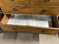 Antique chest of drawers in light wood