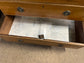 Antique chest of drawers in light wood