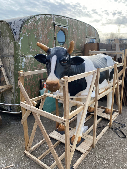 Life-size fiberglass cow statue figure