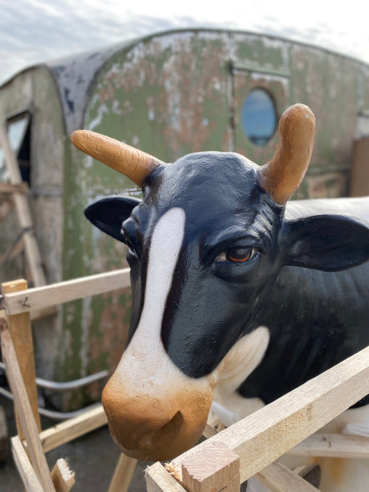 Life-size fiberglass cow statue figure